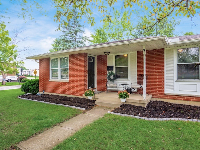 1410 Chelmsford Sq S, Columbus, OH 43229 - single story home with a porch, a front lawn, and brick siding