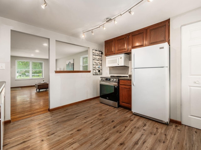 1410 Chelmsford Sq S, Columbus, OH 43229 - kitchen with white appliances, light wood-type flooring, track lighting, and brown cabinetry