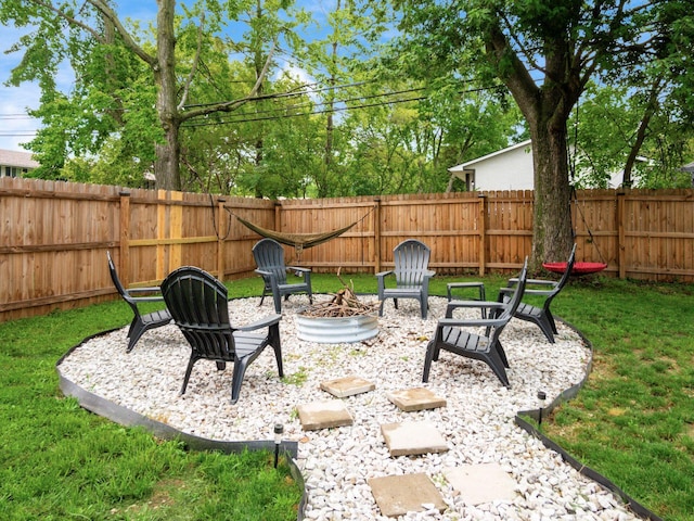 1410 Chelmsford Sq S, Columbus, OH 43229 - fenced backyard featuring a fire pit and a patio area