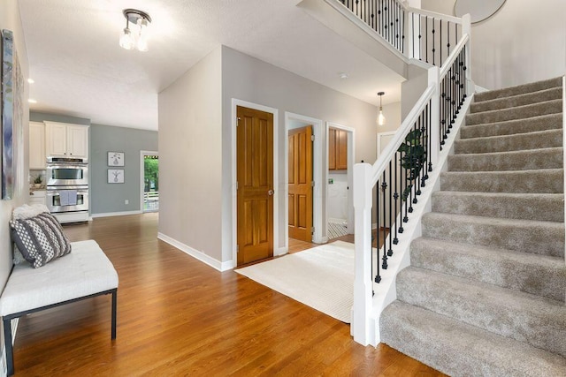 7125 Marrisey Loop, Galena, OH 43021 - staircase featuring wood finished floors and baseboards