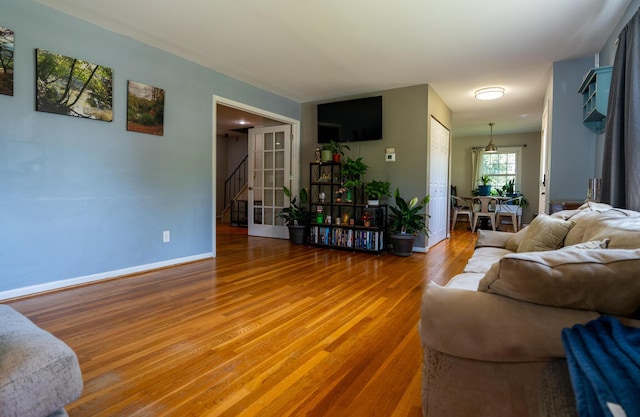 4754 Amesbury Way, Columbus, OH 43228 - living area featuring wood finished floors and stairway