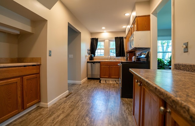 4754 Amesbury Way, Columbus, OH 43228 - kitchen with dishwasher, electric range, brown cabinets, dark wood-style flooring, and recessed lighting