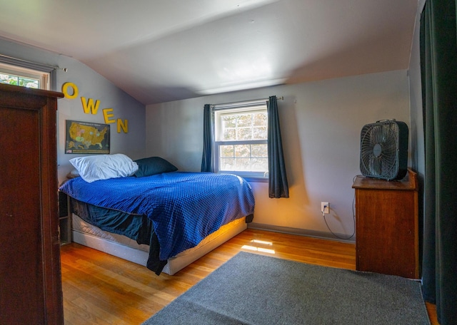 4754 Amesbury Way, Columbus, OH 43228 - bedroom with wood finished floors, vaulted ceiling, and multiple windows
