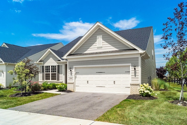 3031 Sinatra Way, Powell, OH 43065 - view of front facade with brick siding, driveway, a garage, and a front yard