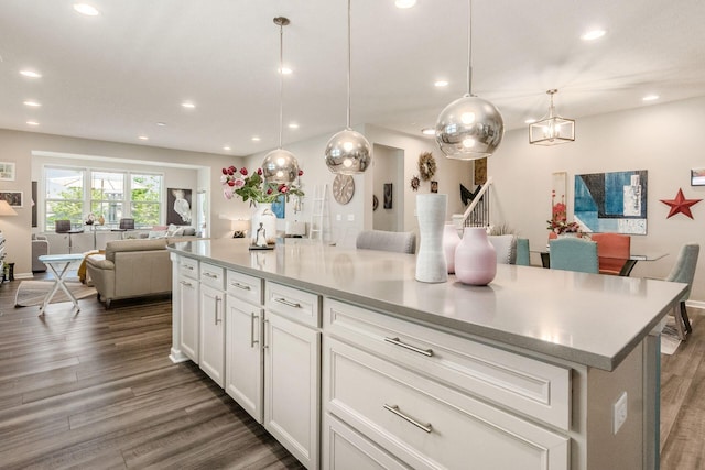 3031 Sinatra Way, Powell, OH 43065 - kitchen with open floor plan, recessed lighting, dark wood-type flooring, white cabinetry, and light countertops