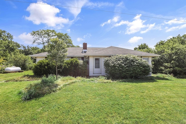 7688 State Route 257, Prospect, OH 43342 - view of front of home with a chimney and a front yard
