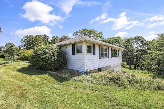 7688 State Route 257, Prospect, OH 43342 - view of property exterior featuring a chimney and a lawn