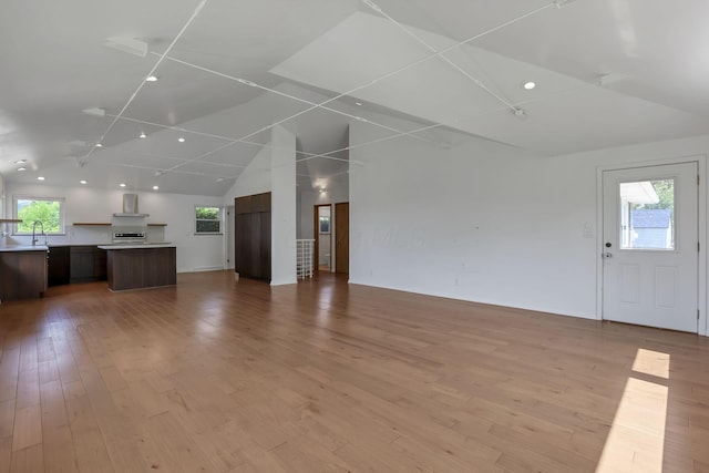 7688 State Route 257, Prospect, OH 43342 - unfurnished living room with lofted ceiling, recessed lighting, and light wood-style floors