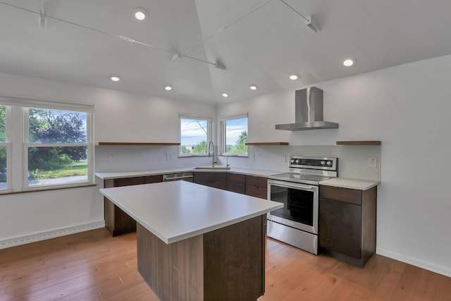 7688 State Route 257, Prospect, OH 43342 - kitchen with stainless steel electric range, wall chimney range hood, light countertops, tasteful backsplash, and modern cabinets