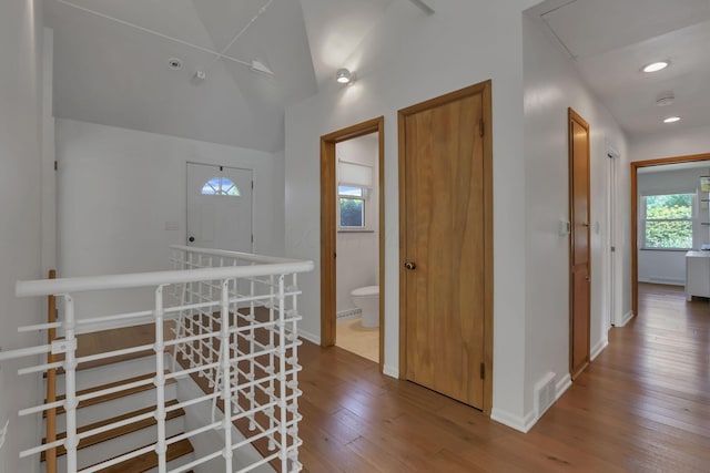 7688 State Route 257, Prospect, OH 43342 - hallway with hardwood / wood-style floors, vaulted ceiling, recessed lighting, and an upstairs landing