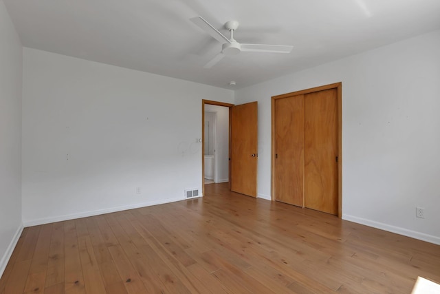 7688 State Route 257, Prospect, OH 43342 - unfurnished bedroom with hardwood / wood-style floors, a closet, and a ceiling fan