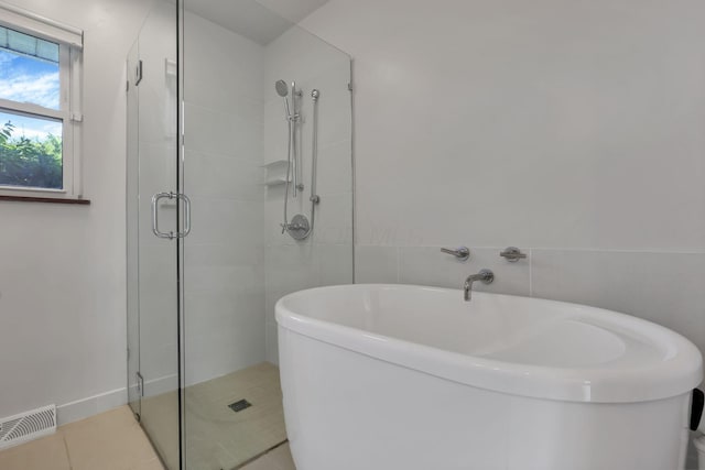 7688 State Route 257, Prospect, OH 43342 - bathroom featuring a stall shower, a soaking tub, and tile patterned floors