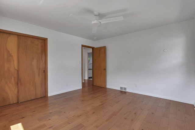 7688 State Route 257, Prospect, OH 43342 - unfurnished bedroom with wood finished floors, a closet, and a ceiling fan