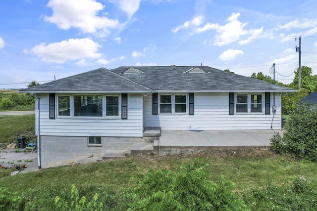 7688 State Route 257, Prospect, OH 43342 - view of front of home with a patio, a front yard, and a shingled roof