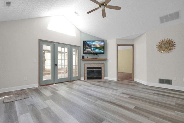 3712 E Links Cir, Hilliard, OH 43026 - unfurnished living room featuring a ceiling fan, a textured ceiling, wood finished floors, high vaulted ceiling, and a fireplace