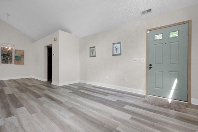 3712 E Links Cir, Hilliard, OH 43026 - foyer entrance with a chandelier, wood finished floors, and lofted ceiling