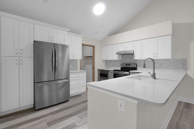 3712 E Links Cir, Hilliard, OH 43026 - kitchen with appliances with stainless steel finishes, under cabinet range hood, light wood-style flooring, vaulted ceiling, and light countertops