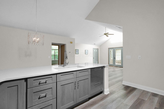3712 E Links Cir, Hilliard, OH 43026 - kitchen featuring gray cabinetry, dishwasher, light wood-type flooring, a chandelier, and vaulted ceiling