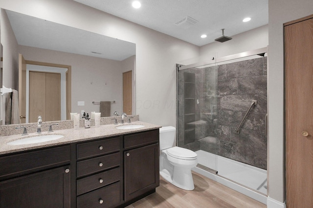 3712 E Links Cir, Hilliard, OH 43026 - full bath with double vanity, wood finished floors, and a stall shower