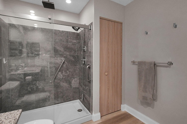 3712 E Links Cir, Hilliard, OH 43026 - full bathroom with wood finished floors, a stall shower, and recessed lighting