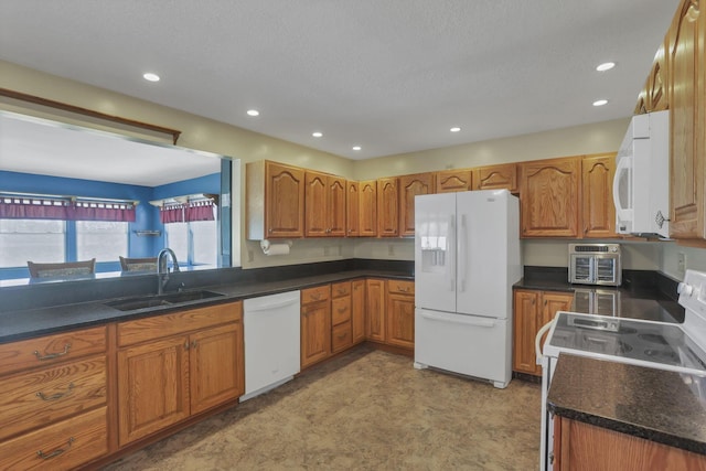 201 Christopher Ct, Hebron, OH 43025 - kitchen with white appliances, brown cabinets, recessed lighting, and a textured ceiling