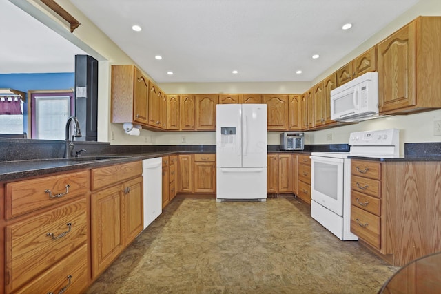 201 Christopher Ct, Hebron, OH 43025 - kitchen featuring white appliances, brown cabinets, and recessed lighting