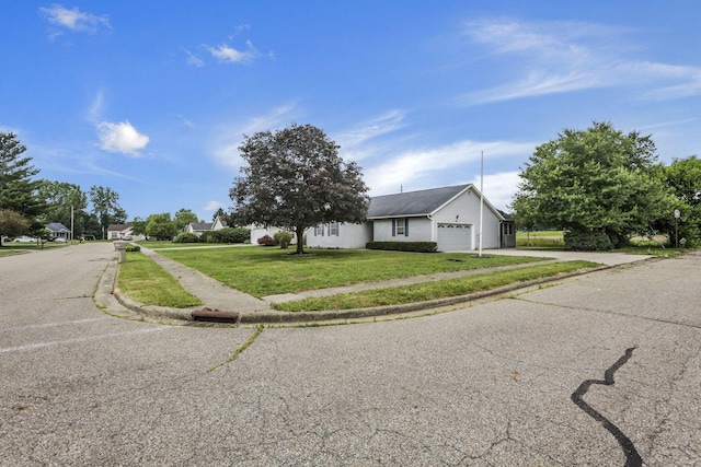201 Christopher Ct, Hebron, OH 43025 - view of front of home with an attached garage, a front lawn, and asphalt driveway