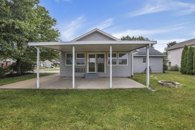 201 Christopher Ct, Hebron, OH 43025 - rear view of property with an outdoor fire pit, a lawn, and a patio