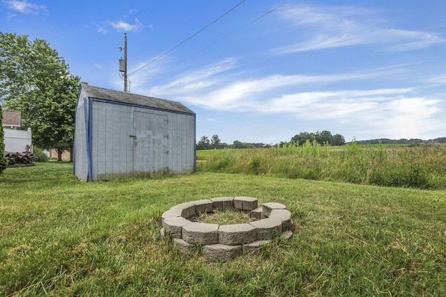 201 Christopher Ct, Hebron, OH 43025 - view of green lawn with a fire pit, a shed, and a view of rural / pastoral area