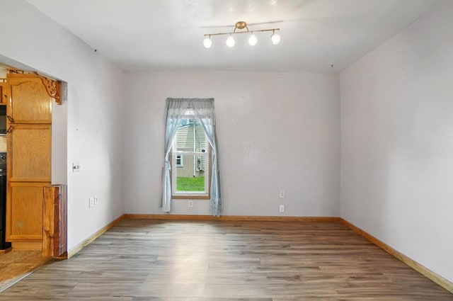 99 N Williams St, Newark, OH 43055 - empty room featuring light wood-type flooring and baseboards