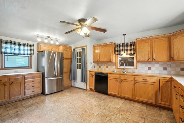 99 N Williams St, Newark, OH 43055 - kitchen featuring freestanding refrigerator, dishwasher, light countertops, a ceiling fan, and decorative backsplash
