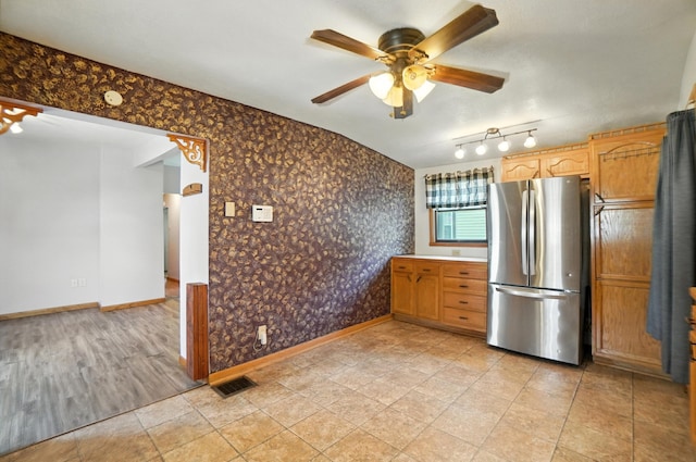 99 N Williams St, Newark, OH 43055 - kitchen featuring freestanding refrigerator, ceiling fan, and wallpapered walls