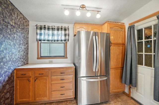 99 N Williams St, Newark, OH 43055 - kitchen featuring freestanding refrigerator, wallpapered walls, light countertops, light tile patterned floors, and track lighting