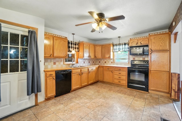 99 N Williams St, Newark, OH 43055 - kitchen featuring black appliances, light countertops, backsplash, and ceiling fan