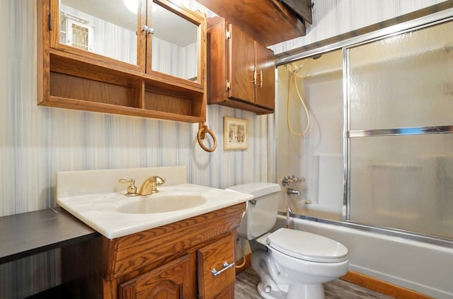 99 N Williams St, Newark, OH 43055 - full bathroom featuring wallpapered walls, bath / shower combo with glass door, and vanity