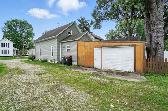 99 N Williams St, Newark, OH 43055 - view of front facade featuring driveway, a garage, and roof with shingles
