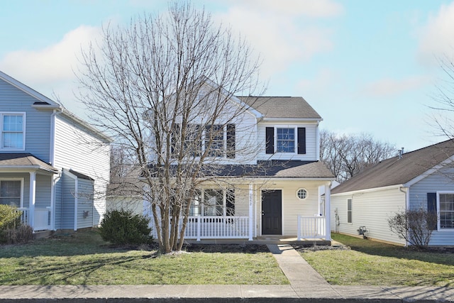 1852 Meadowlawn Dr, Columbus, OH 43219 - traditional-style home featuring a porch, a front yard, and roof with shingles