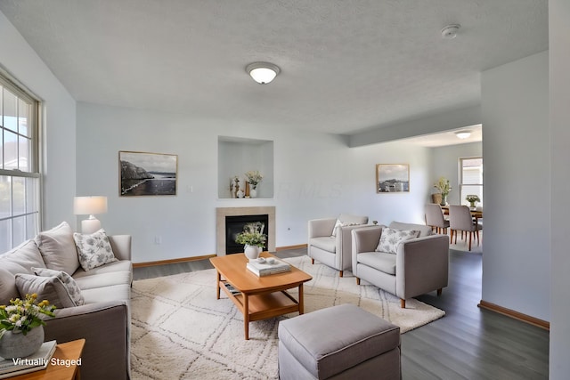 1852 Meadowlawn Dr, Columbus, OH 43219 - living area with wood finished floors, a fireplace, and a textured ceiling