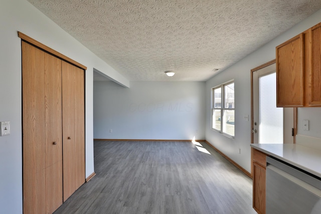 1852 Meadowlawn Dr, Columbus, OH 43219 - unfurnished dining area with wood finished floors and a textured ceiling