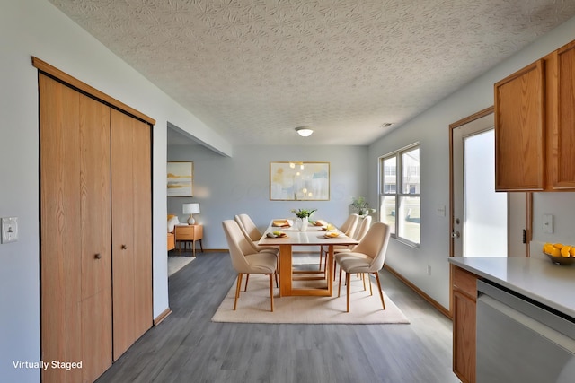 1852 Meadowlawn Dr, Columbus, OH 43219 - dining area featuring wood finished floors and a textured ceiling