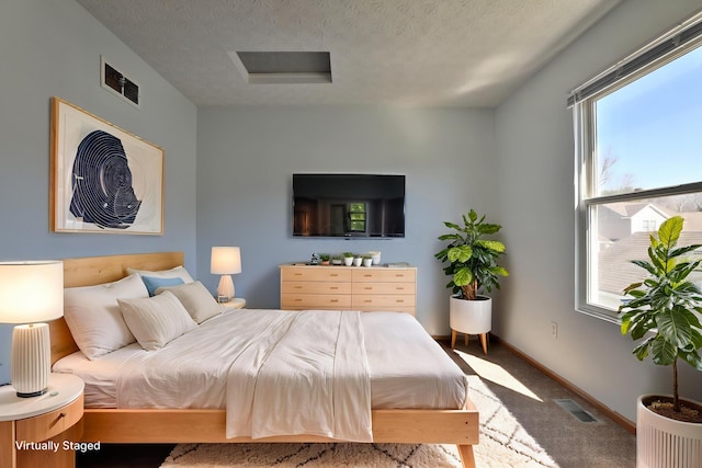 1852 Meadowlawn Dr, Columbus, OH 43219 - bedroom featuring carpet flooring, a textured ceiling, and attic access