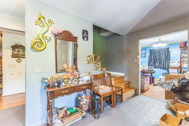 123 Deerwalk Cir, Marietta, OH 45750 - hallway featuring tile patterned flooring and a chandelier