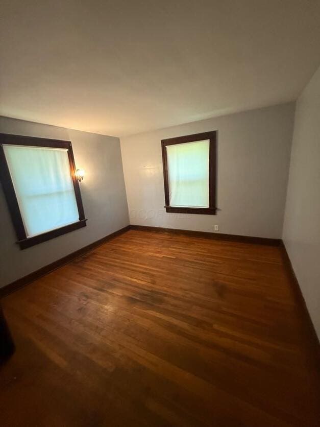 289 S Walnut St, Wilmington, OH 45177 - empty room with wood finished floors and baseboards