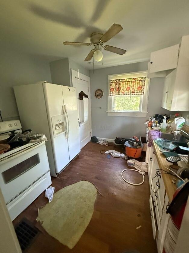 289 S Walnut St, Wilmington, OH 45177 - kitchen with white appliances, a ceiling fan, white cabinets, and dark wood finished floors