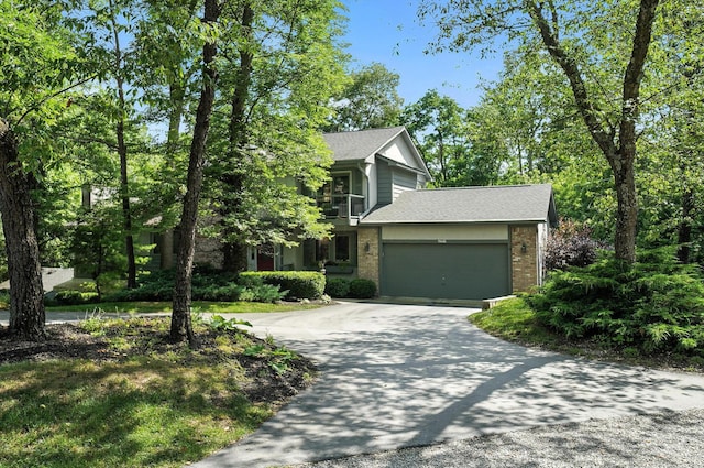 96 Executive Ct Unit B, Westerville, OH 43081 - view of front facade with asphalt driveway, brick siding, an attached garage, and roof with shingles