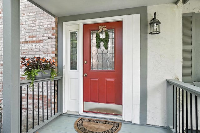 96 Executive Ct Unit B, Westerville, OH 43081 - doorway to property featuring covered porch and brick siding