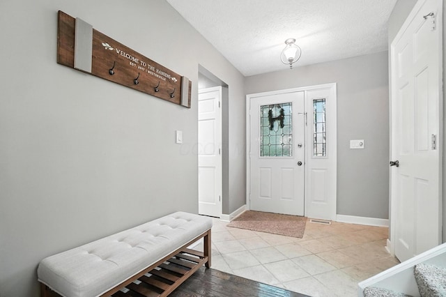 96 Executive Ct Unit B, Westerville, OH 43081 - foyer with baseboards and a textured ceiling