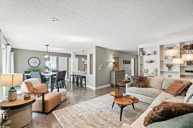 96 Executive Ct Unit B, Westerville, OH 43081 - living room featuring wood-type flooring, a textured ceiling, and a chandelier