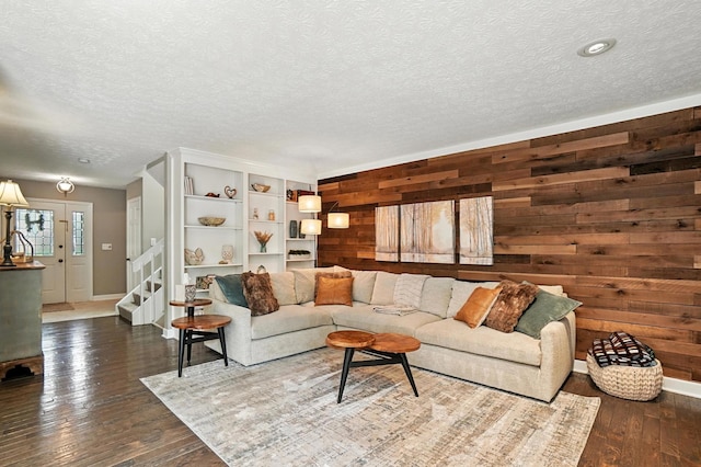 96 Executive Ct Unit B, Westerville, OH 43081 - living area featuring wood walls, wood-type flooring, a textured ceiling, and stairs