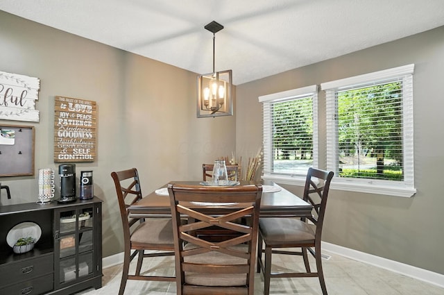 96 Executive Ct Unit B, Westerville, OH 43081 - dining space with light tile patterned flooring and a chandelier